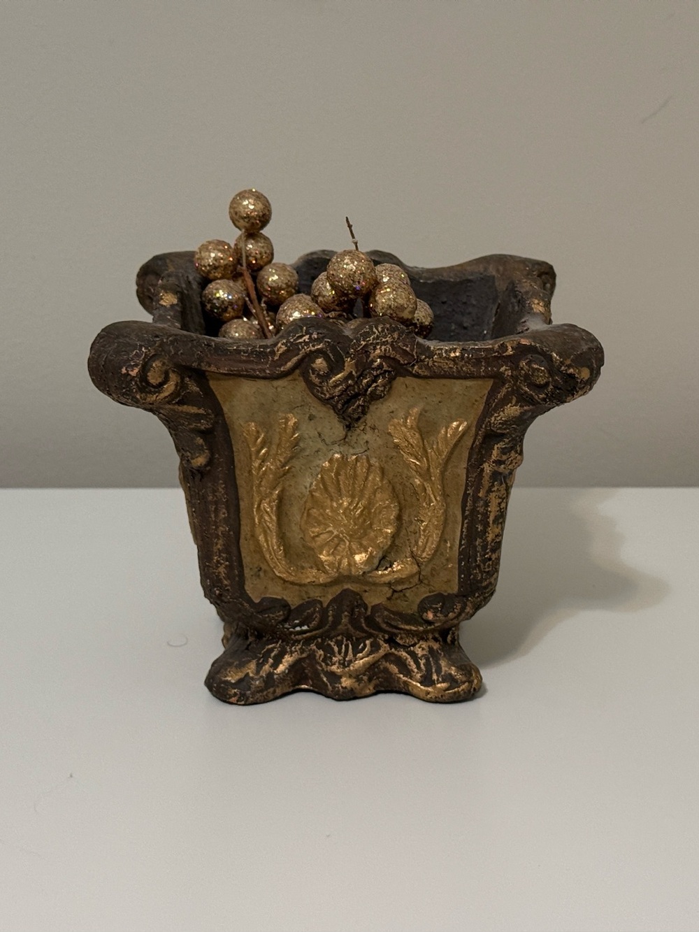 Vintage Hollywood Regency style resin planter.